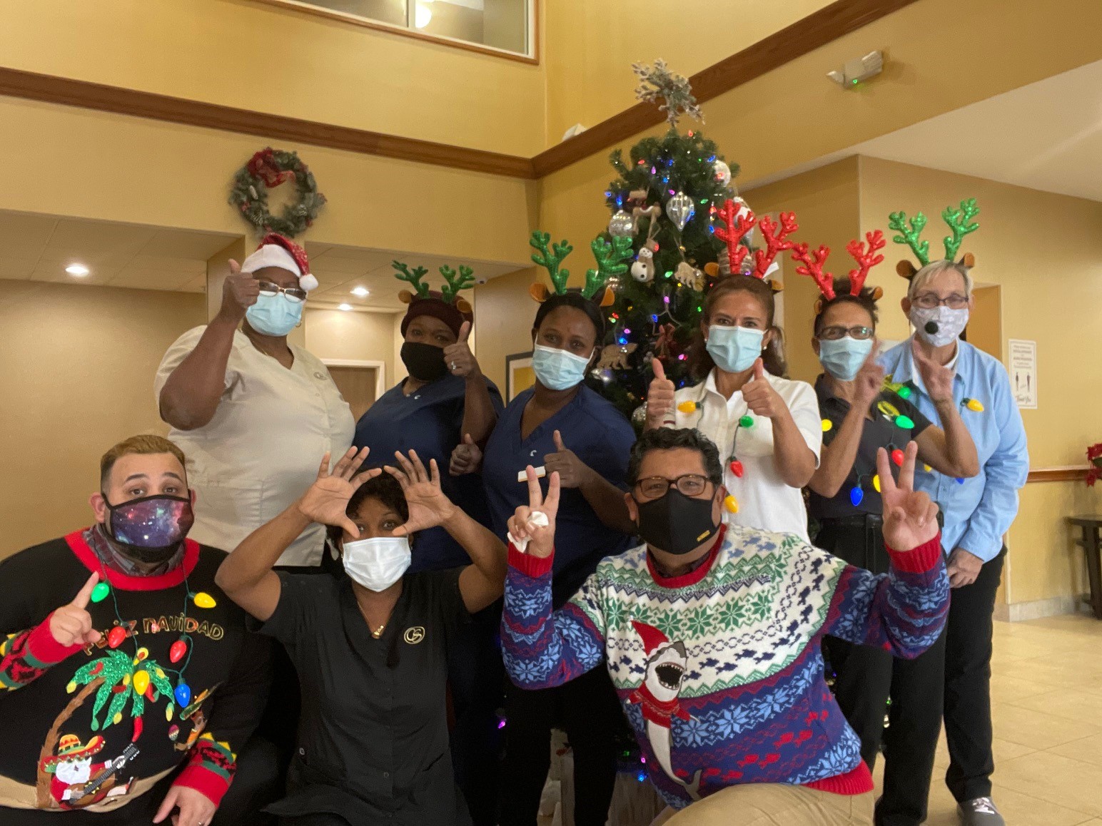 Hotel employees wearing masks during Christmas party