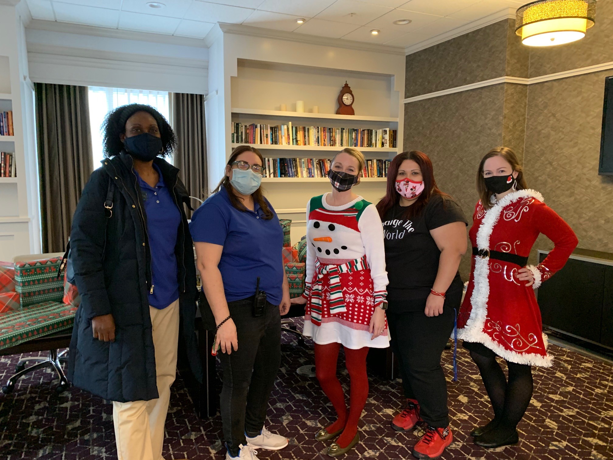 Hotel employees dressed up for a Christmas party